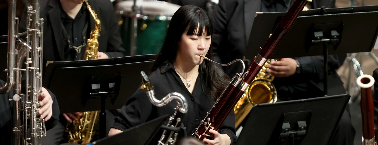 A promotional graphic for CCM Wind Symphony