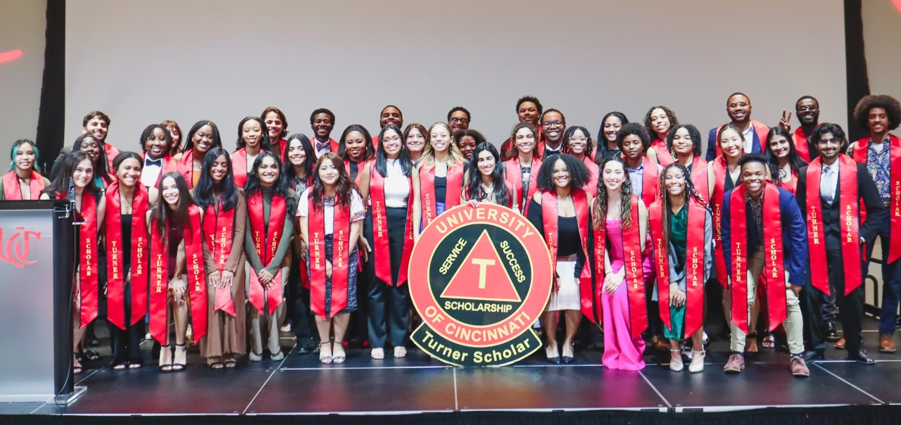 Jan Rotich receiving award.