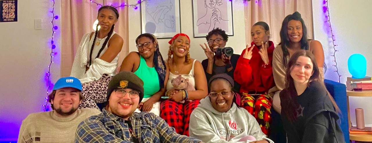 The creative team of "Sonder" poses on set. 