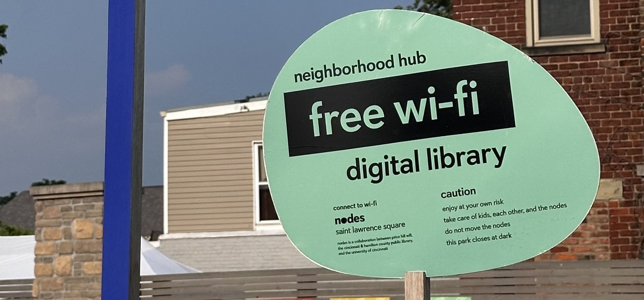 Green sign signaling free Wi-Fi in the area. 