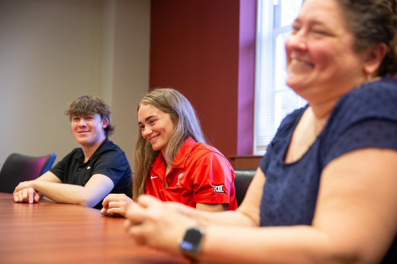 UC students Juliette Laracuente-Huebner and Brandon Mueller were taking different sessions of Deanna Herbers American Sign Language (ASL) course when they discovered they were cousins.