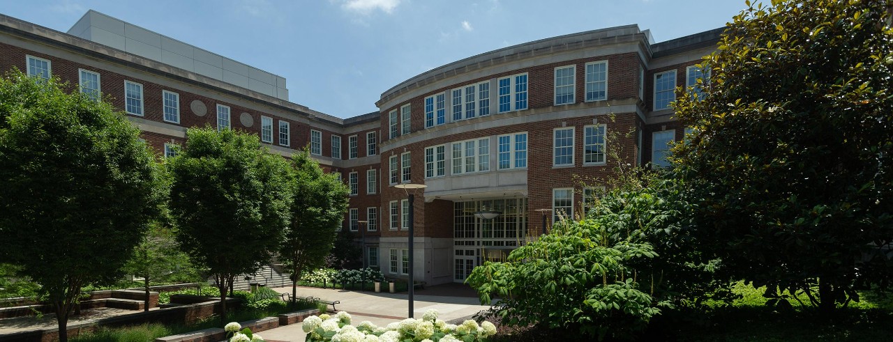 The Teachers-Dyer-Complex is home to the UC School of Education. Showing is facade of the complext: red brick with white stone trim. 