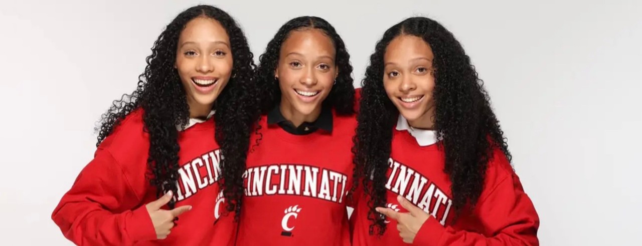 Sisters Brooke, Brianna and Brittany Jones shown in UC sweatshirts
