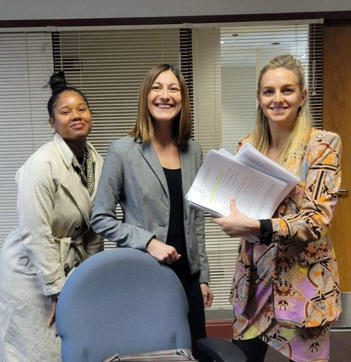 From left, OIP attorneys Shantya Goddard and Lauren Staley, and attorney Kimberly Kendall Corral, counsel for Lenworth Edwards, receiving copies of Monday's filing.