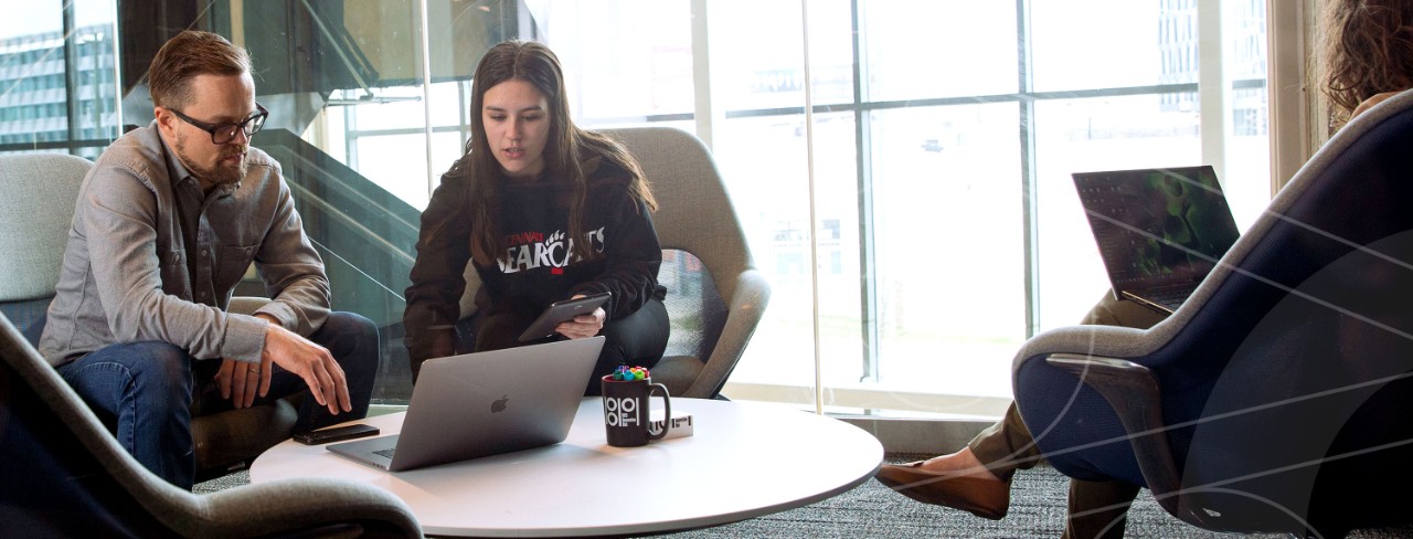People working in an 1819 meeting room. Photo/Gregory Glevicky