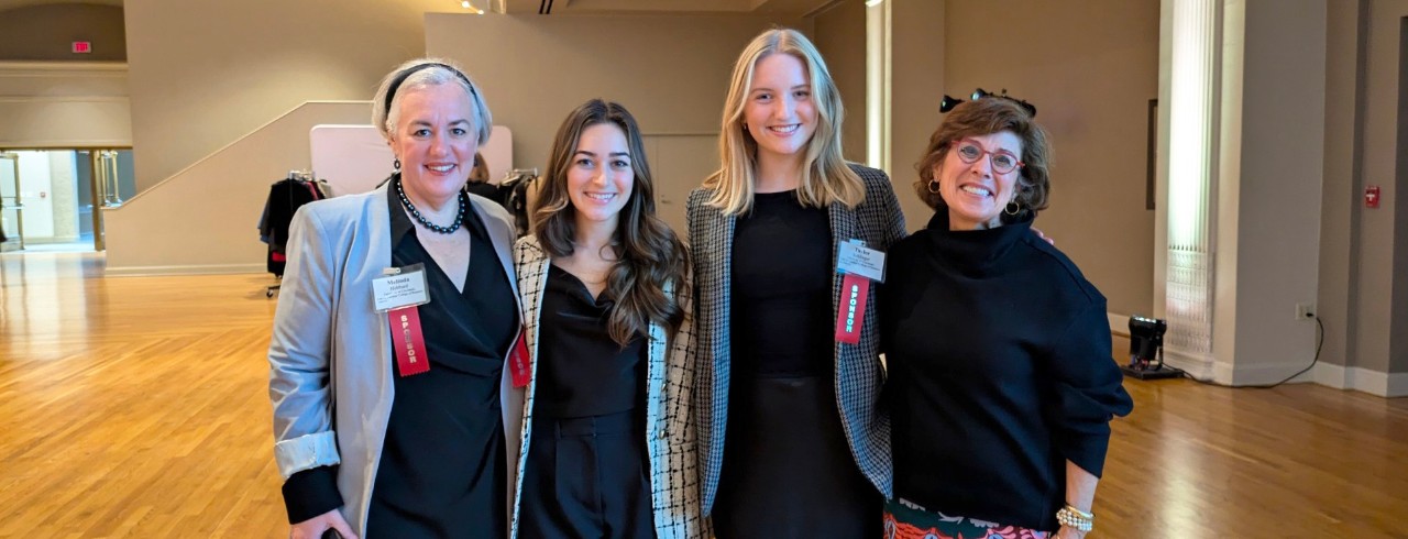 four women in business attire at the 2024 Women Who Mean Business event