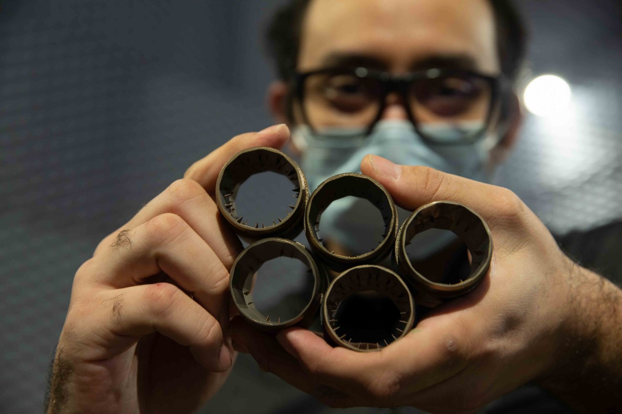 UC aerospace engineering professor Ephraim Gutmark and his students are designing quieter jet engines in his lab. The U.S. Navy will test his designs on an F-18 fighter plane in October at the U.S. Naval Research Laboratory. Shown here is doctoral student Mohammad Saleem.