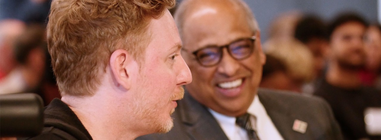 Chris Wanstrath speaks with President Neville Pinto. 