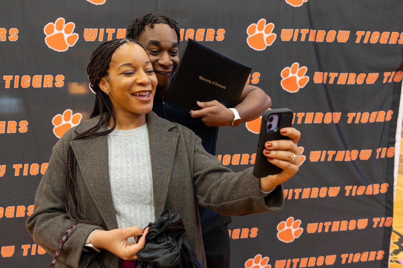 UC celebrates Decision Day 2025 student surprises. Withrow High School, Oliver Tiani Vessah and Harsh Minhas (Marian Spencer Scholars).
