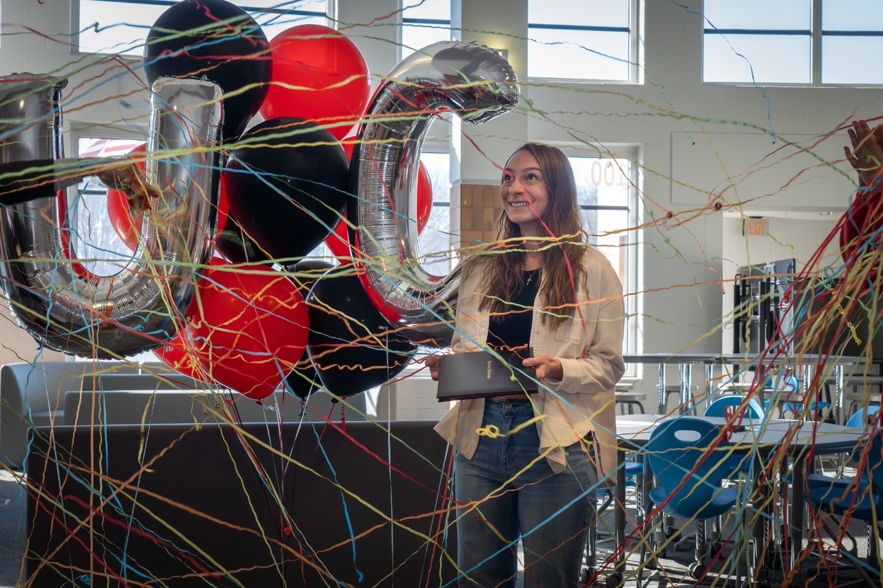 The UC Clermont admissions team surprises Bethel-Tate senior Lily Hathcock with news of her admission and scholarships to the college on UC’s annual Decision Day Jan. 28.