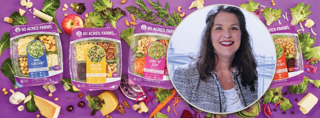 Headshot image of UC alumna Tisha Livingston inset in picture of packages of salad mixes.