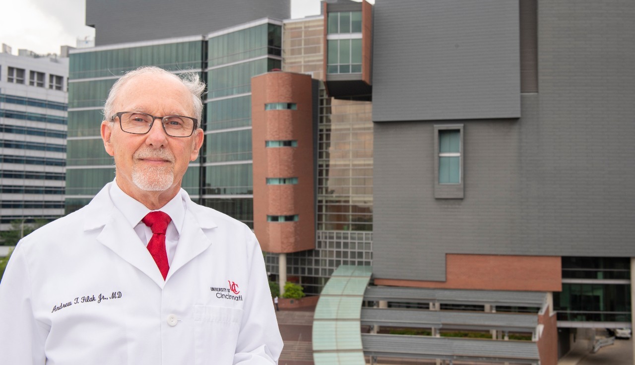 Former UC College of Medicine Dean Andrew Filak, MD, stands outside the CARE/Crawley building on campus.