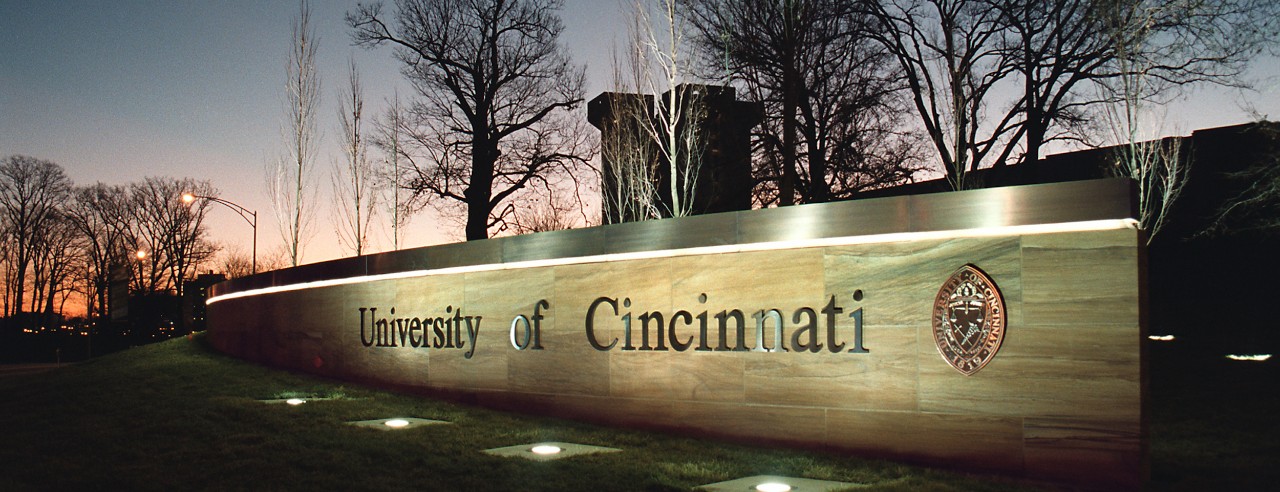 University of Cincinnati sign near the MLK Avenue entrance at Uptown West campus.