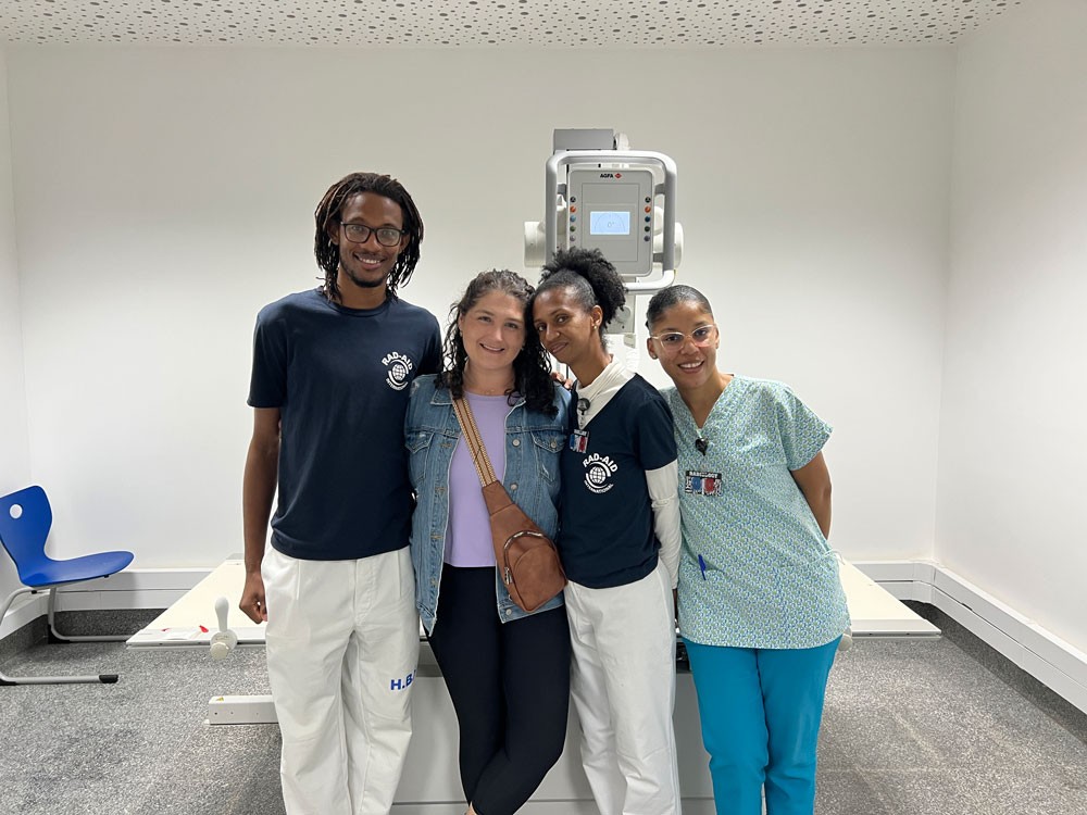 professor with three students in radiology lab