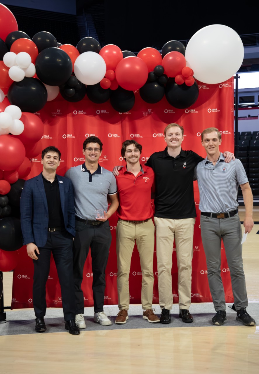 QL Plus team holding their award at the 2025 CEAS Expo