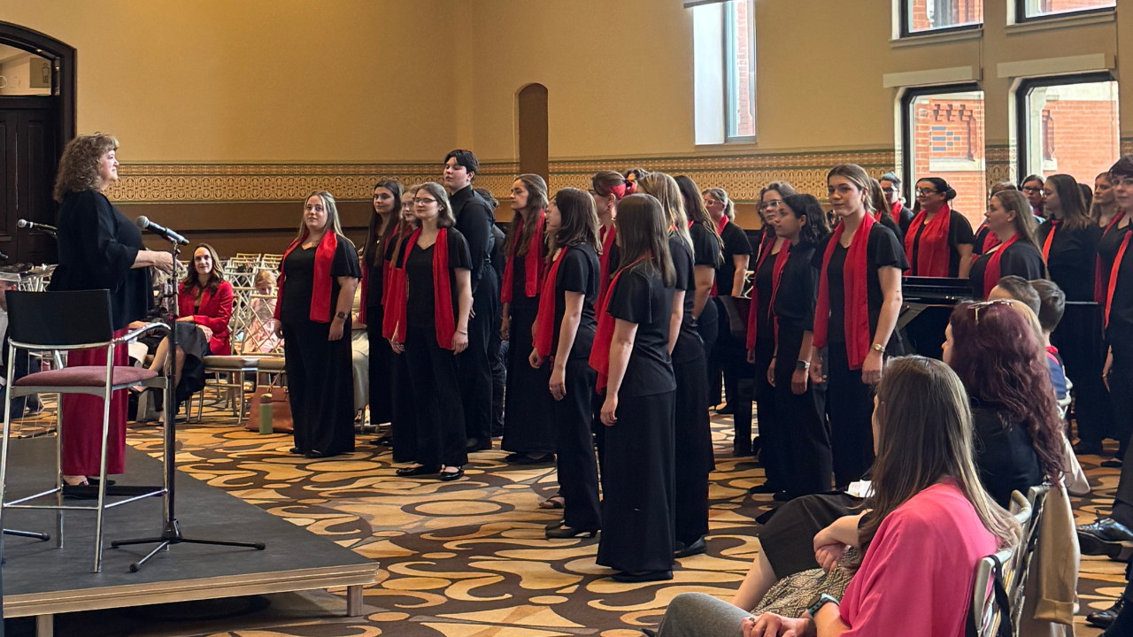 Miami University Choraliers group sings