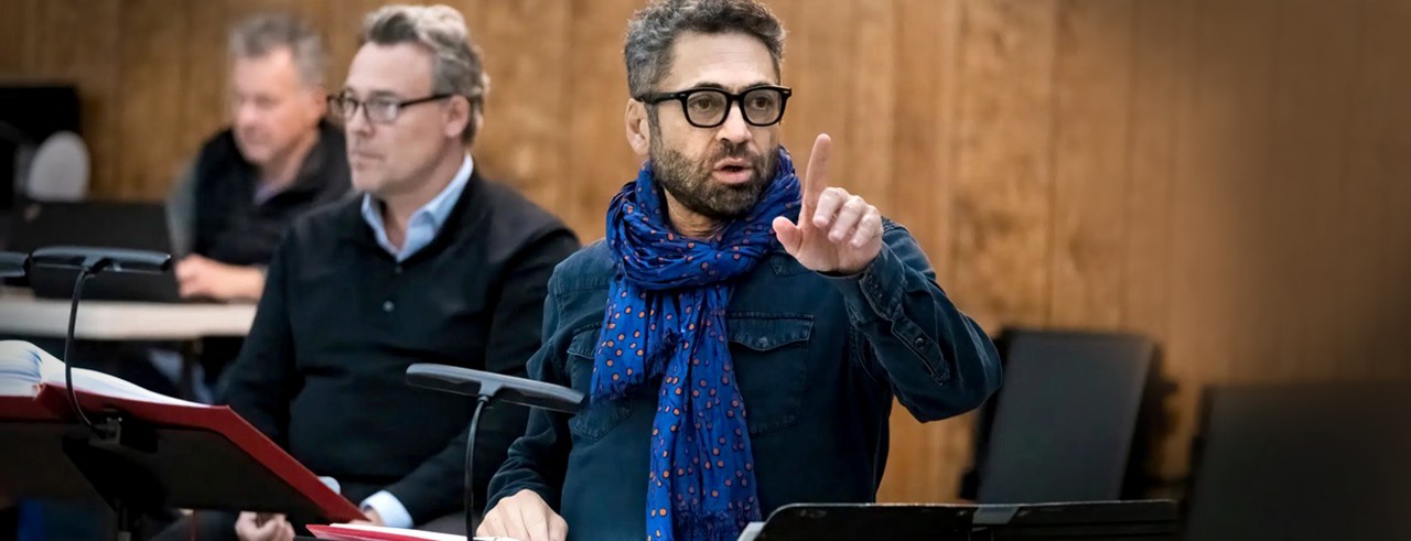A photograph of Jose Maria Condemi (center) directing a rehearsal of 'Salome' at San Diego Opera in March 2025. Pictured to the left of Condemi is the conductor of that production, Maestro Yves Abel. Photo/Karli Cadel