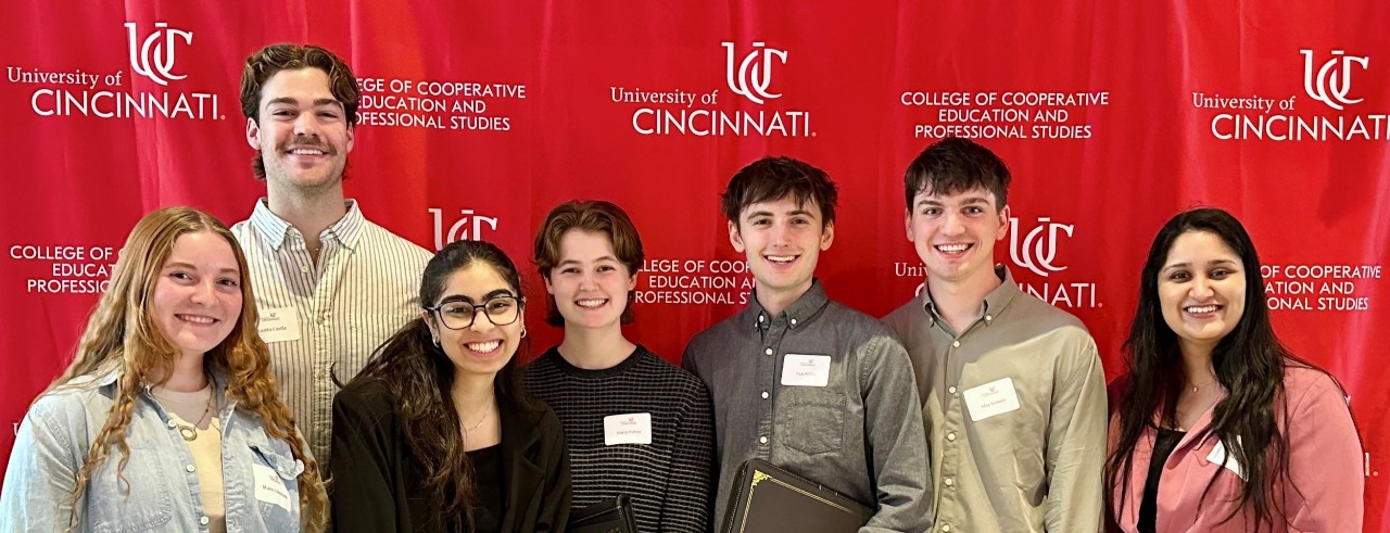 group of students holding award certificates