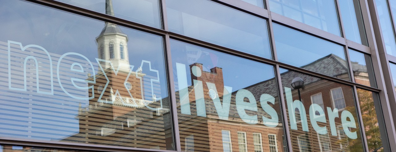 University of Cincinnati campus building reflected in windows