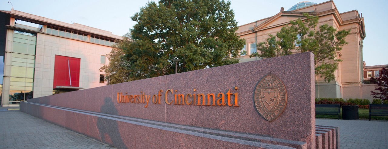 marble sign reading "University of Cincinnati"