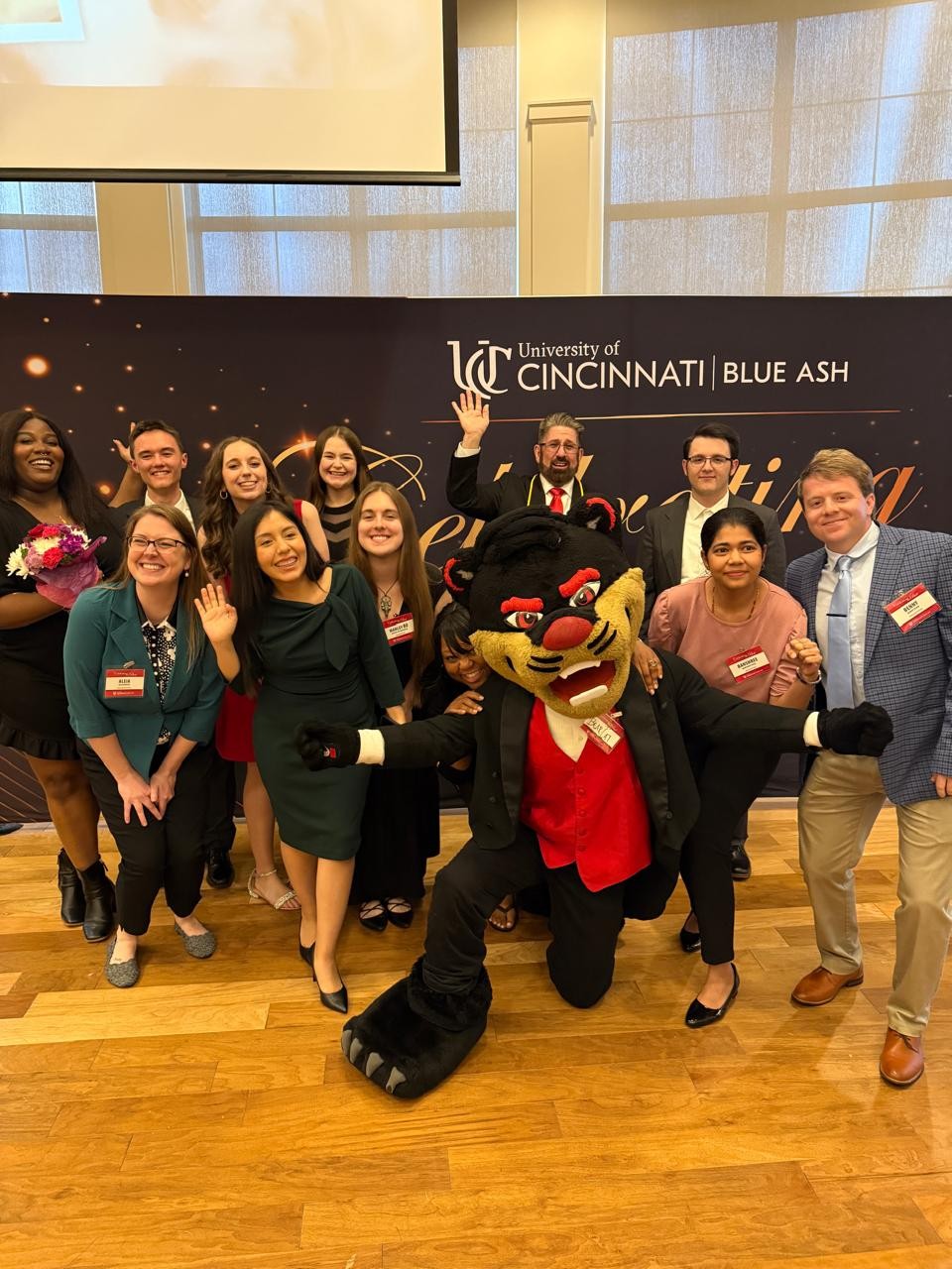 Bearcat mascot with group of students
