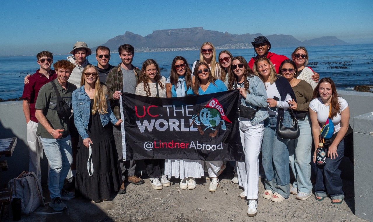 Lindner study abroad students, entrepreneurs and professor Manning smile for a group photo.