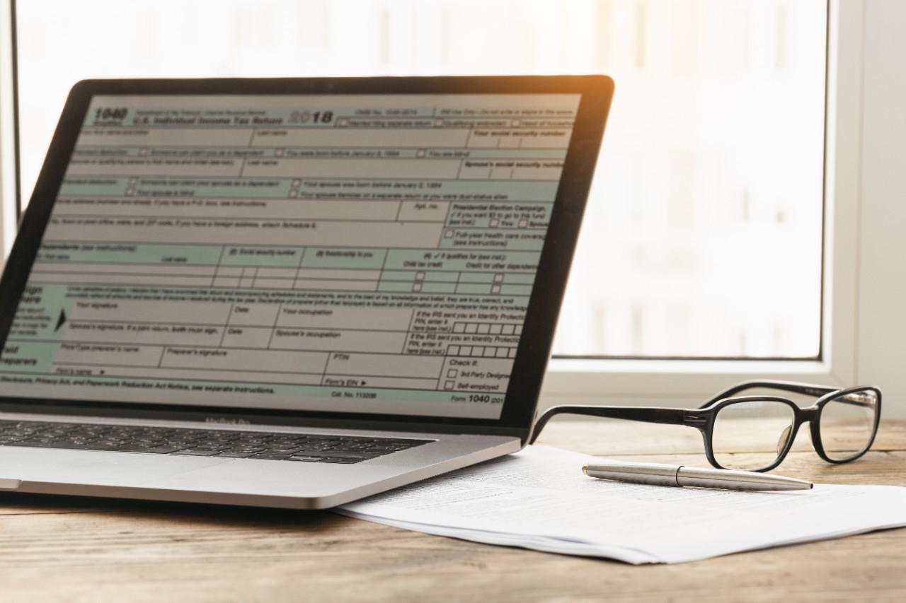 A computer with tax returns on it