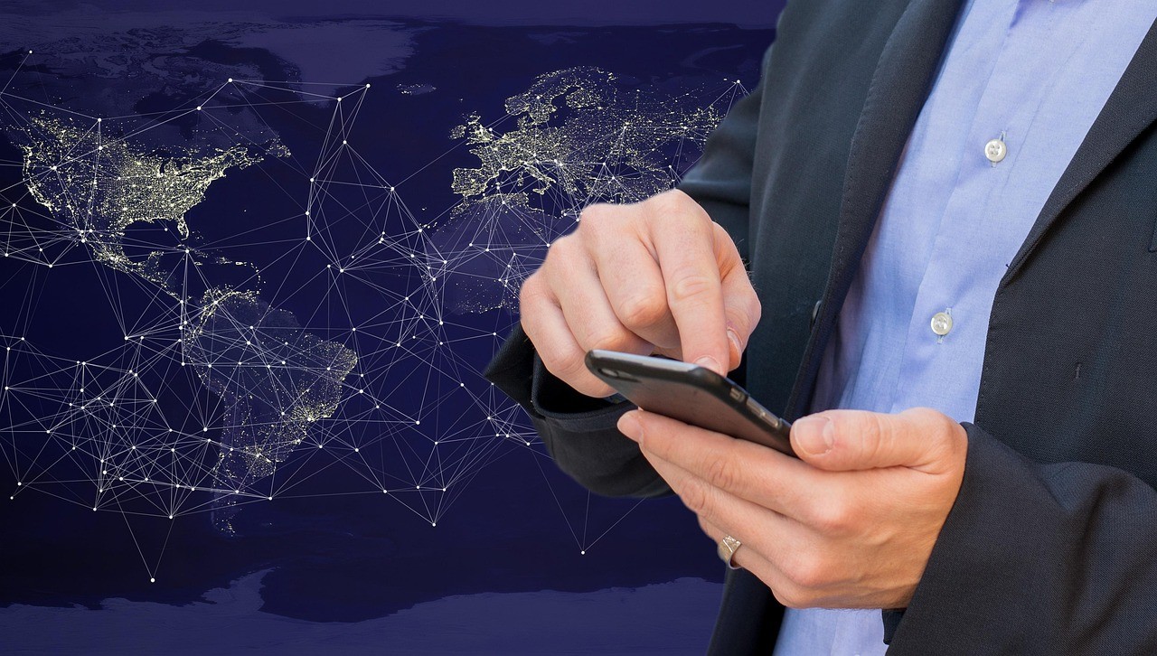 Man tapping on mobile device.