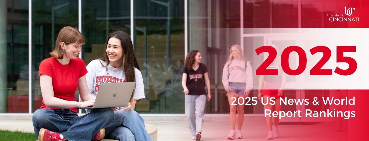 Image of students using a laptop outside. Red gradient on the right side of the image. Reads: "2025 US News and World Report Rankings" 