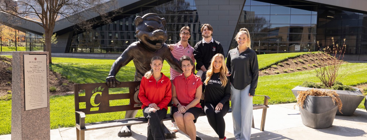 Kim Dobbs and five students at the Bearcat Bench
