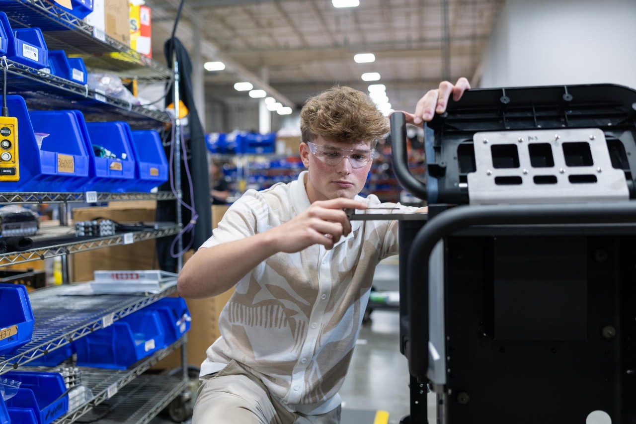 College of Engineering and Applied Science student Nathan Weis co-ops at Cold Jet with industrial designer Dave Burbrink, a former UC co-op in DAAP. Also pictured: UC engineering co-op Ryan O’Reilly and Cold Jet employee and UC engineering alumnus Rob Kocol.