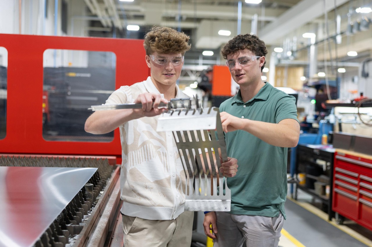 College of Engineering and Applied Science student Nathan Weis co-ops at Cold Jet with industrial designer Dave Burbrink, a former UC co-op in DAAP. Also pictured: UC engineering co-op Ryan O’Reilly and Cold Jet employee and UC engineering alumnus Rob Kocol.