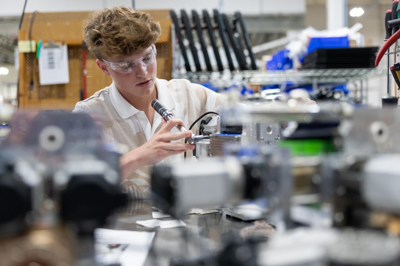 College of Engineering and Applied Science student Nathan Weis co-ops at Cold Jet with industrial designer Dave Burbrink, a former UC co-op in DAAP. Also pictured: UC engineering co-op Ryan O’Reilly and Cold Jet employee and UC engineering alumnus Rob Kocol.