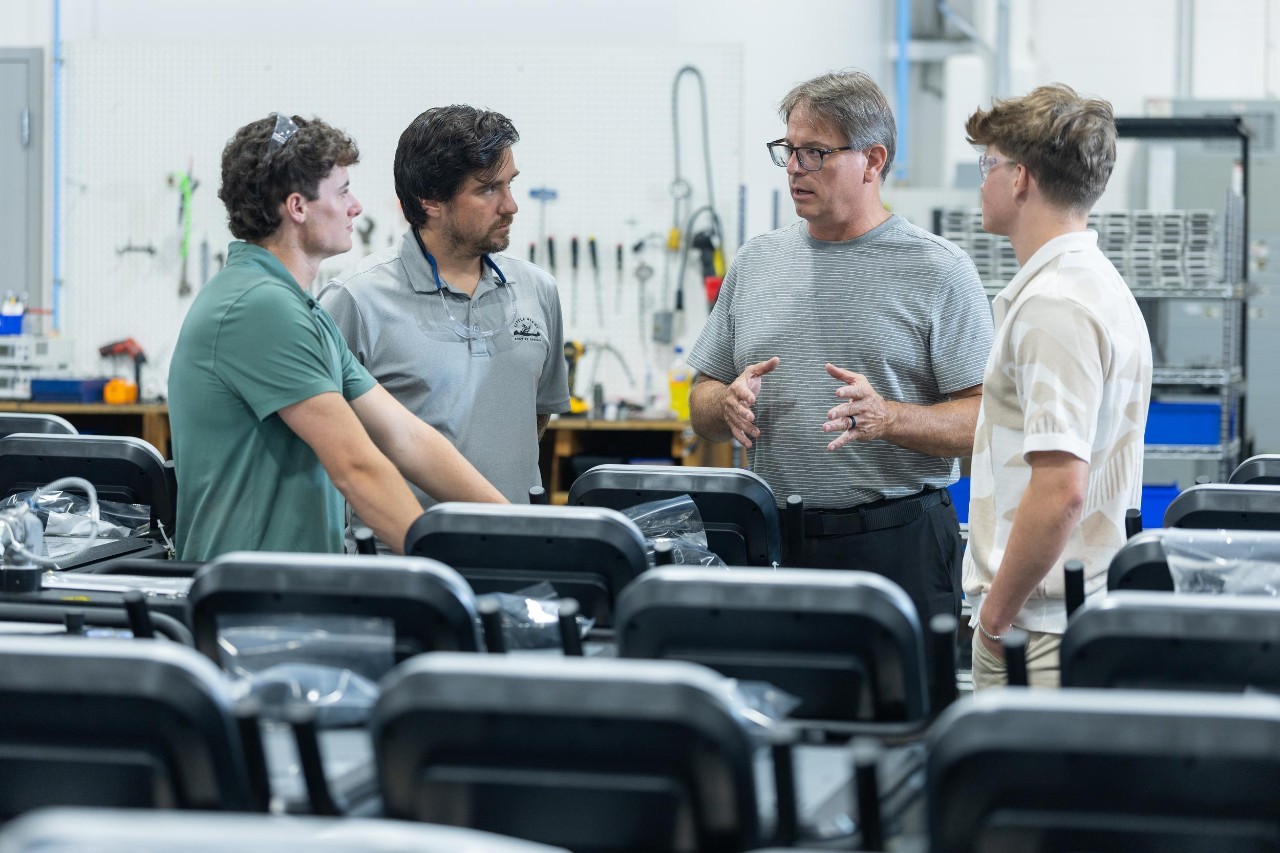 College of Engineering and Applied Science student Nathan Weis co-ops at Cold Jet with industrial designer Dave Burbrink, a former UC co-op in DAAP. Also pictured: UC engineering co-op Ryan O’Reilly and Cold Jet employee and UC engineering alumnus Rob Kocol.