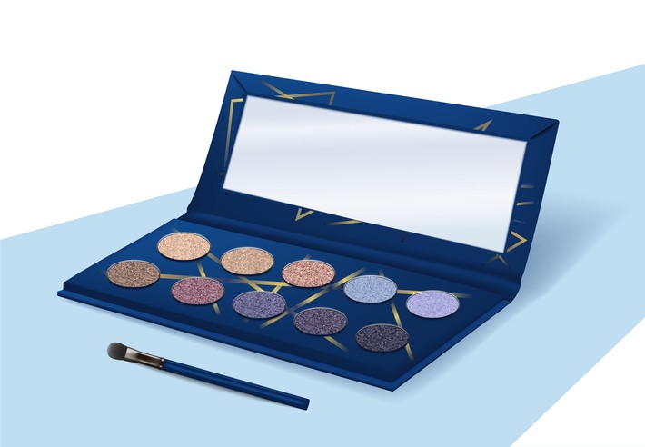 A glittery eye shadow palette with a mirror and brush