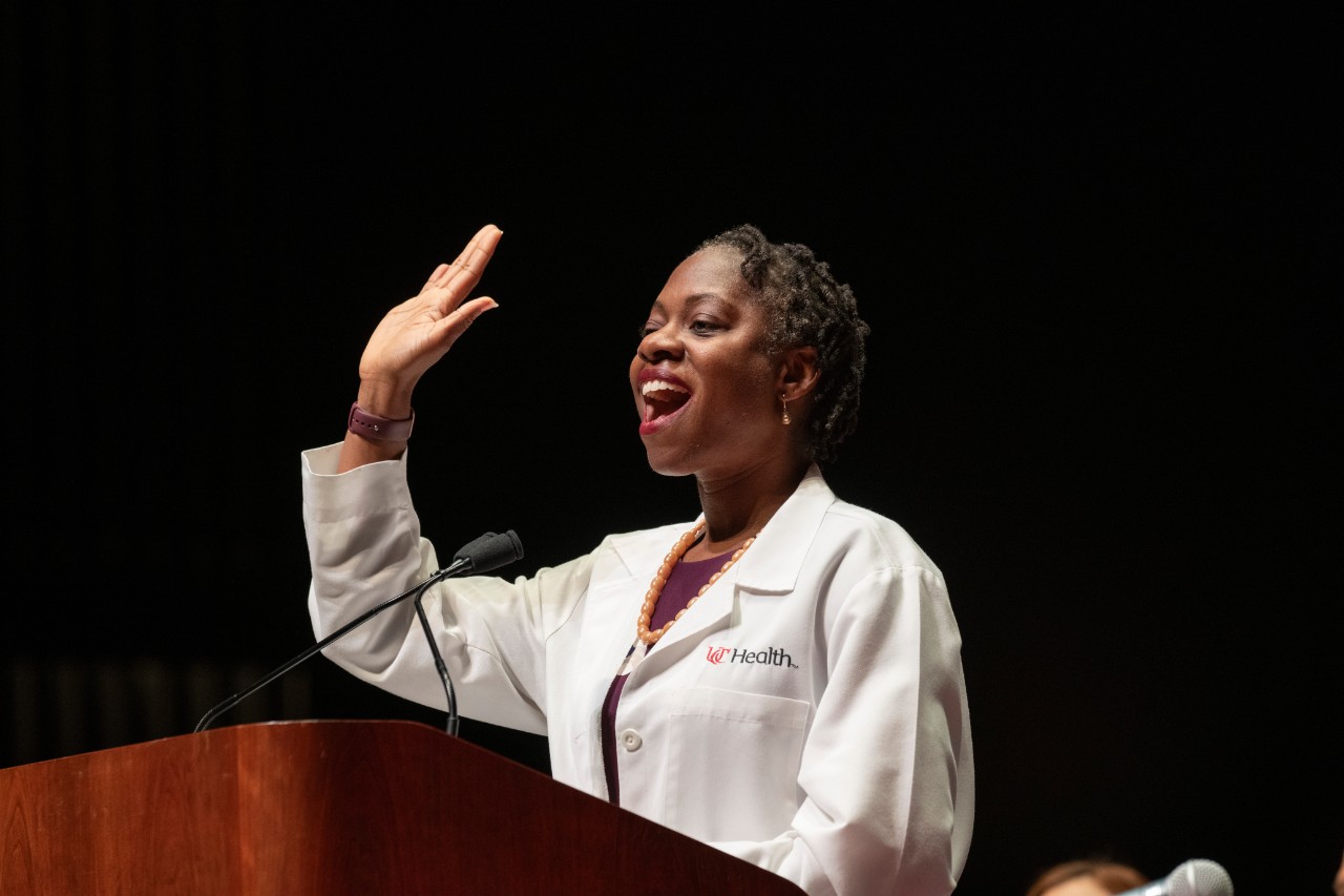 University of Cincinnati College of Medicine Dr. Bi A. Awosika, MD, FACP, SFHM, assistant Dean for Admissions and keynote speaker gestured as she spoke during the University of Cincinnati’s College of Medicine White Coat ceremonies for the class of 2029 Friday August 1, 2025 at Aronoff Center for the Arts in Downtown, Cincinnati. Photo by Joseph Fuqua II 