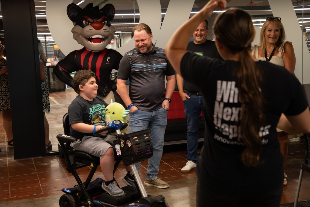 Jared on his mobility scooter tours the Esports Lab. 