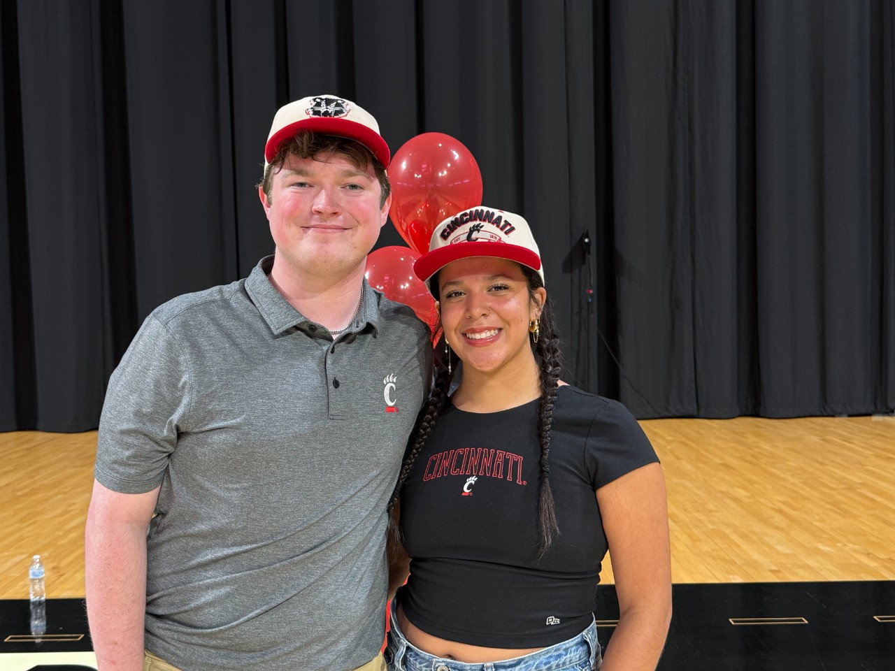 Joshua Copley and Wilaini Alicea pose for a photo together at Fifth Third Arena.