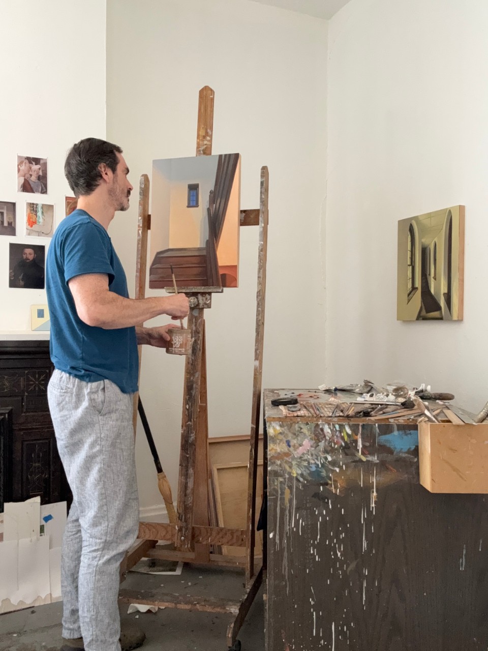 Emil Robinson painting in his studio. 
