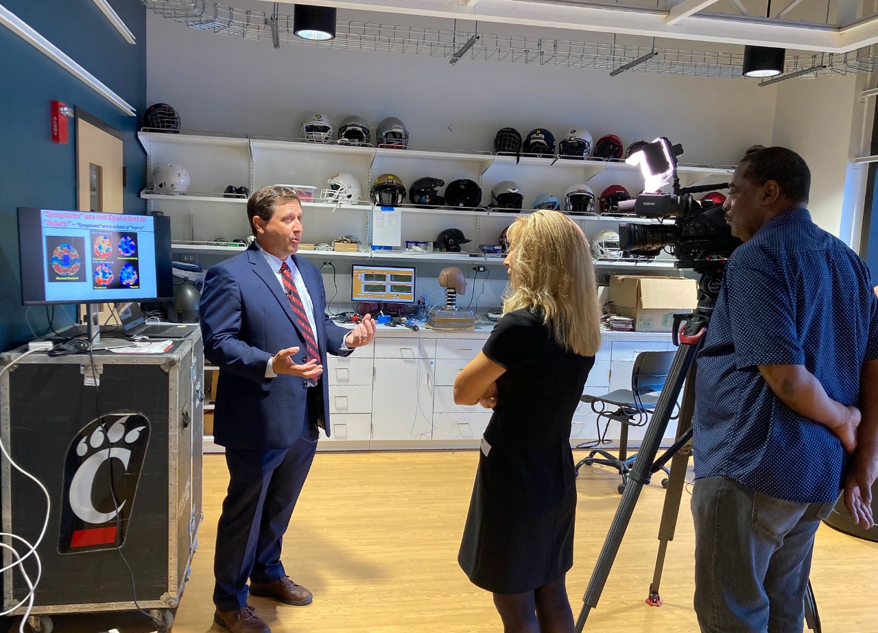 Tom Talavage talks to Local 12 reporters in a UC's Bioscience Center.