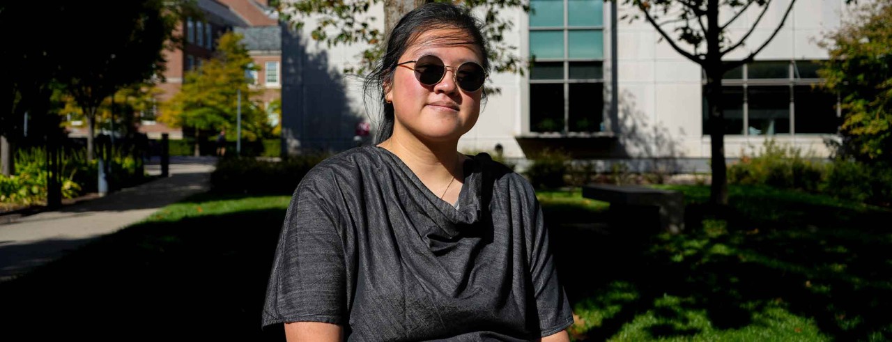 Joey Yong sits outside on a windy day