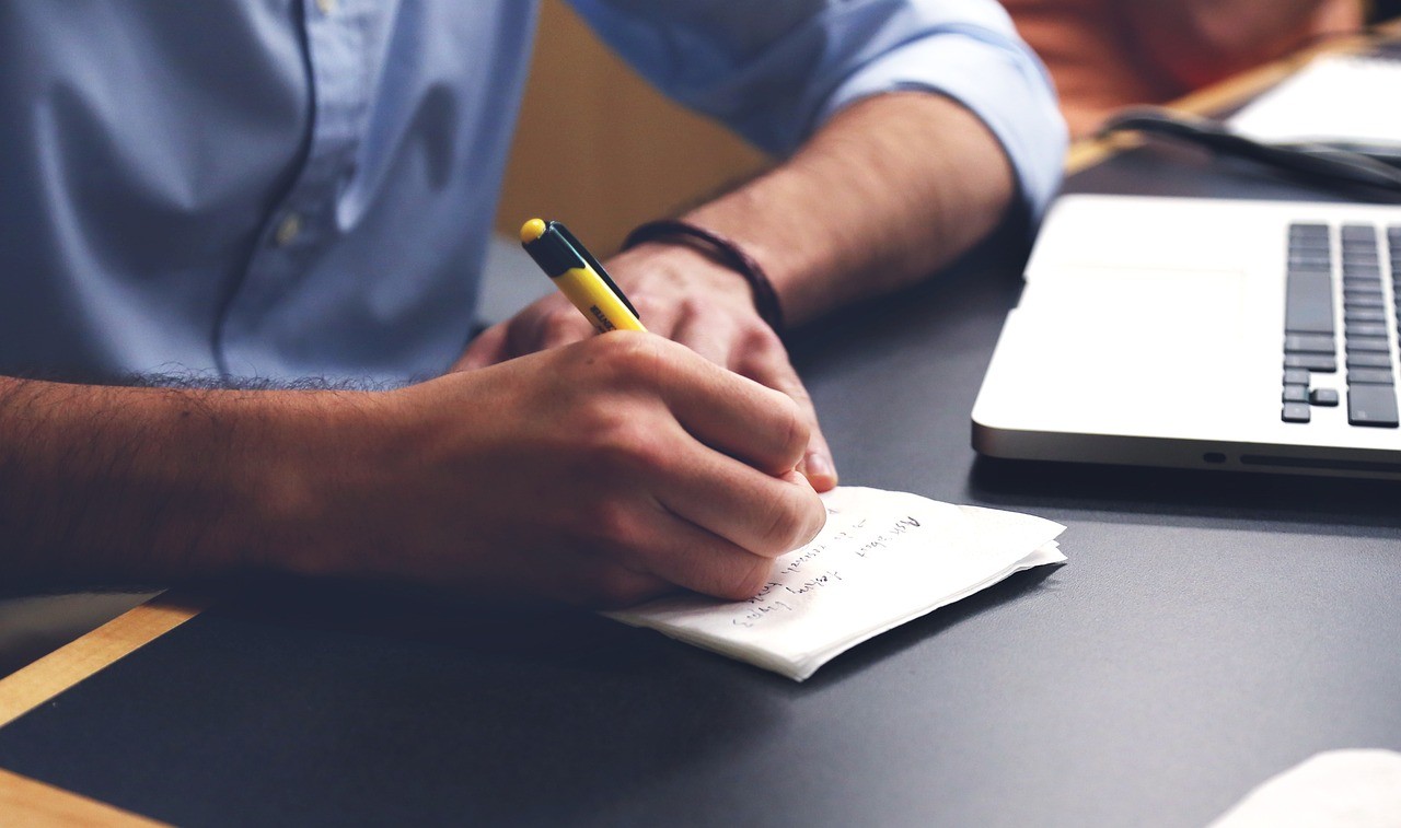 Man working at a desk.