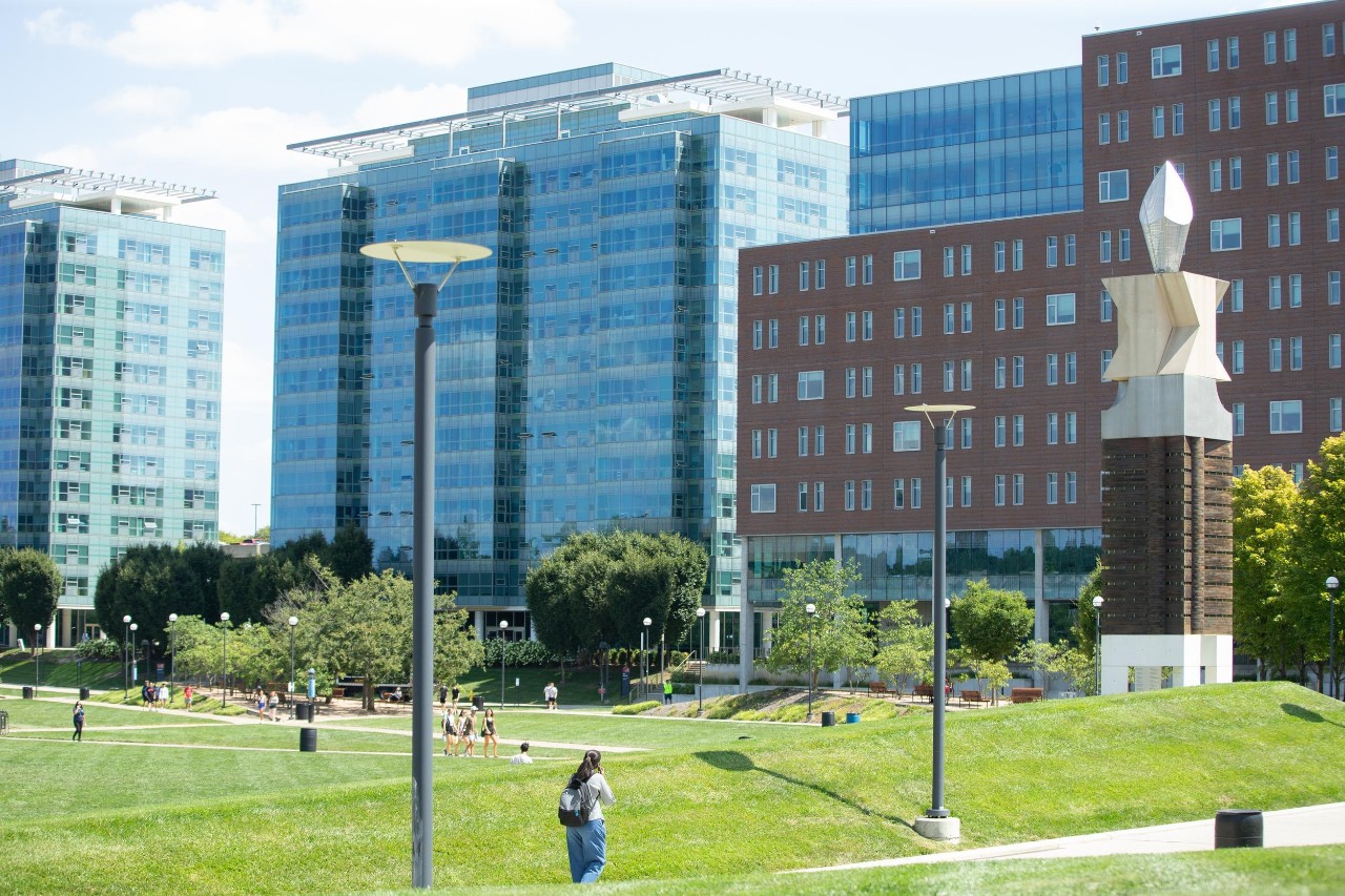 image of campus dorms overlooking green space on UC campus known as Sigma Sigma Commons