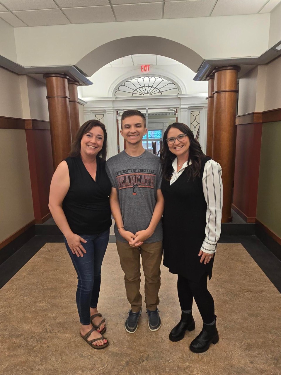 student with parent and director of program