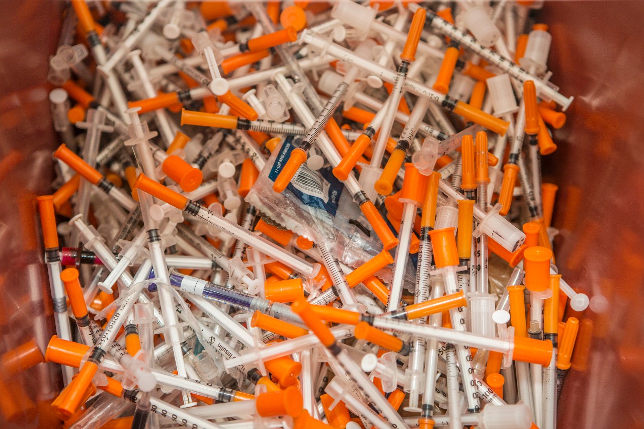 Dr. Judith Feinberg and her assistant work on the "Cincinnati Exchange Project," which allows heroin addicts to exchange dirty needles for safe ones.