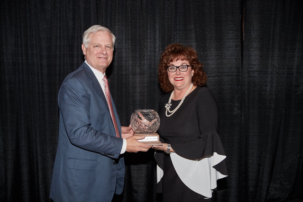 UC student Terri Reed accepts her award during the ceremony.