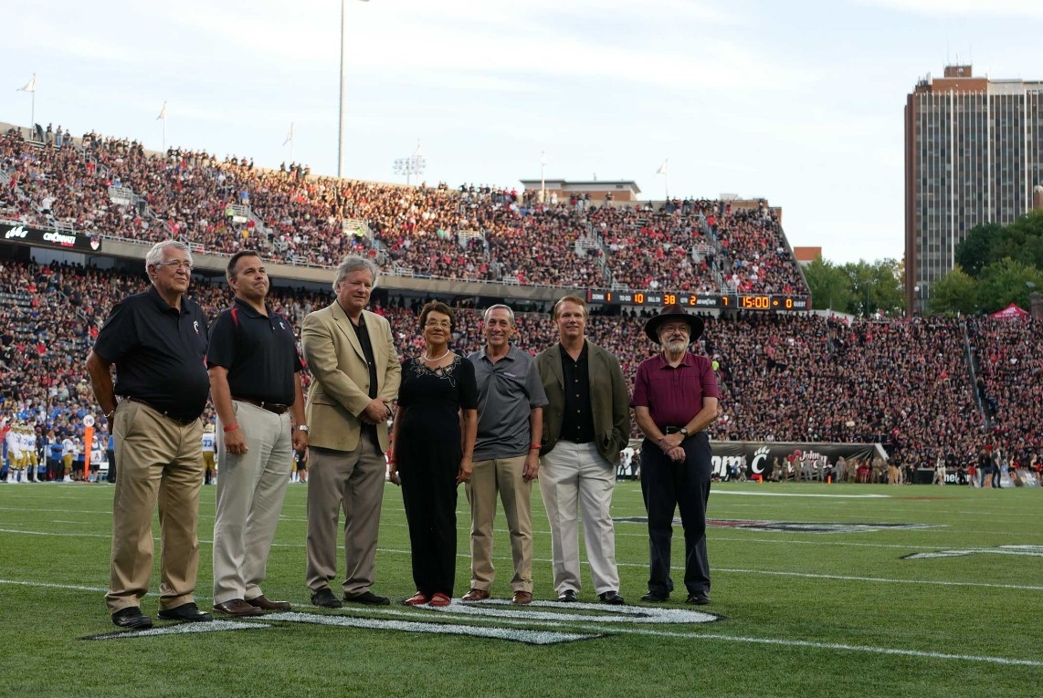 Honored on the field during the UC vs. UCLA football game Gary Slater, left, Paul Orkwis, Rick Armstrong, Awatef Hamed, Ralph Spitzen, Mark Armstrong, and Tom Black. Photo/Corrie Stookey/CEAS Marketing