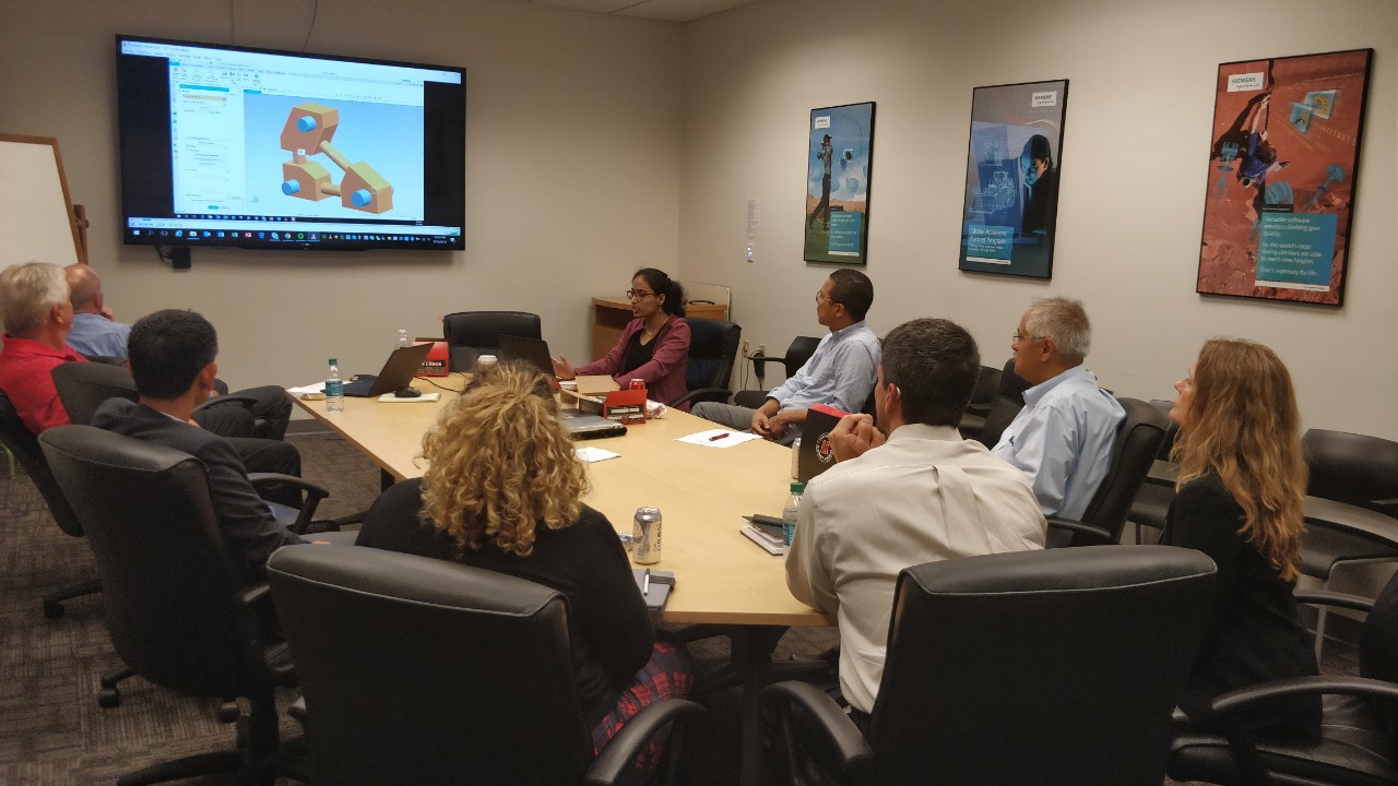 The two groups meeting in a boardroom