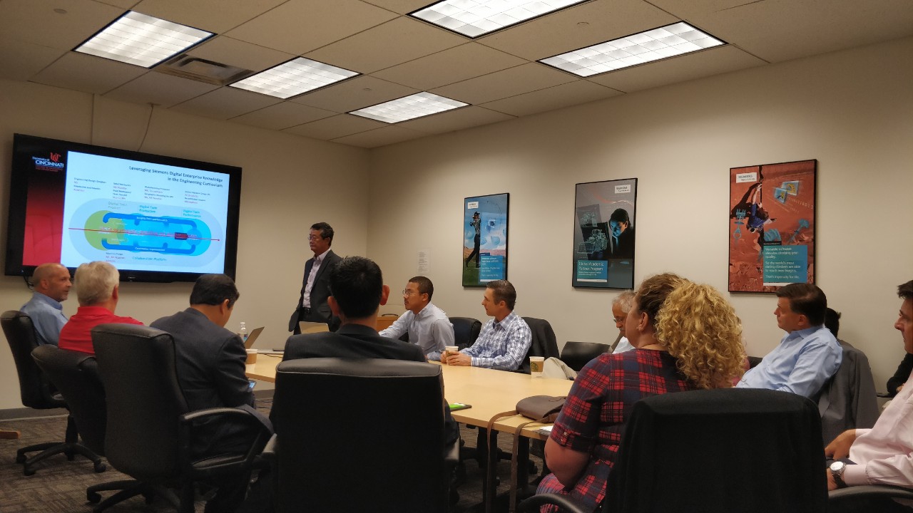 The two groups meeting in a boardroom