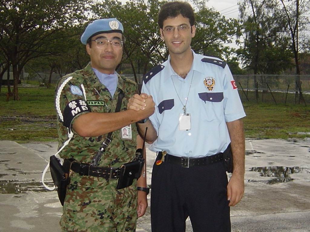 Dr. Murat Ozer as a Police Officer in Turkey with another male